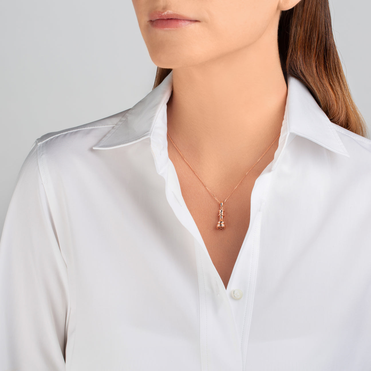 The Queen Rose Gold Chess Necklace by Ksenia Mirella Jewellery worn with white shirt styling