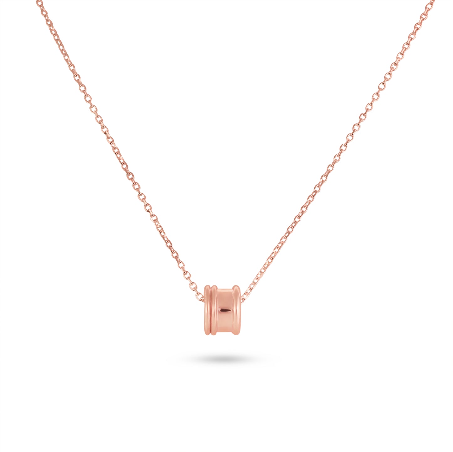 Rose gold necklace with a cylindrical pendant on a white background