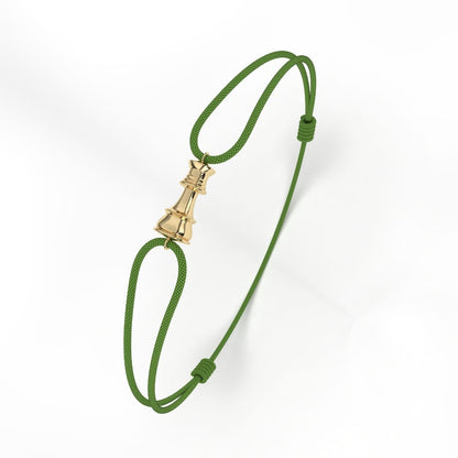 Green cord bracelet with a gold clasp on a white background