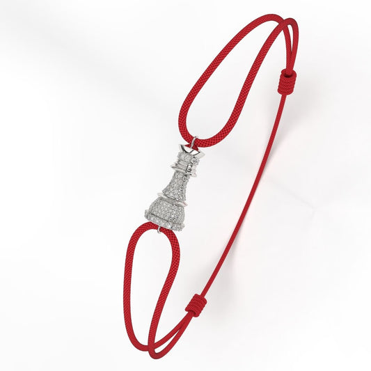 A Silver bracelet with white diamond pavé accents, featuring a red cord-style fastening.