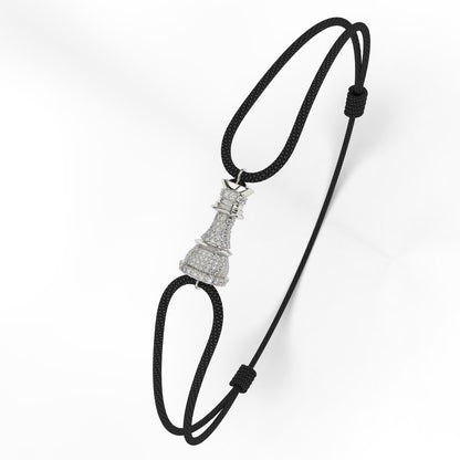 A Silver bracelet with white diamond pavé accents, featuring a black cord-style fastening.