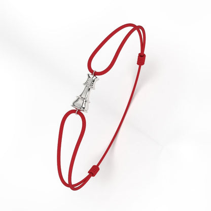 A silver clasp with red cord bracelet on a white background, part of the Queen Collection.