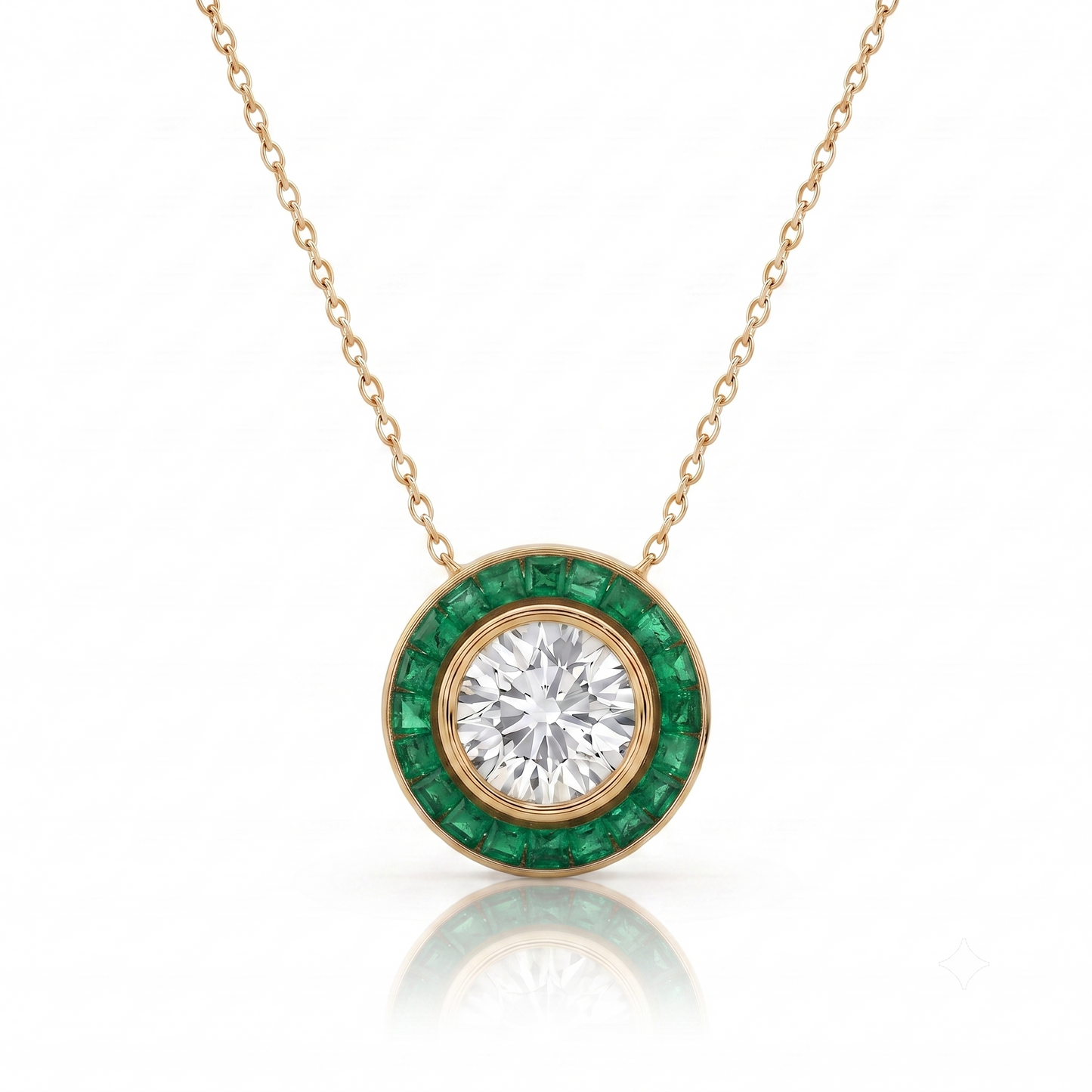 A gold pendant necklace featuring a round-cut clear center stone surrounded by a halo of round green emerald-cut stones, suspended from a delicate gold chain on a white background.