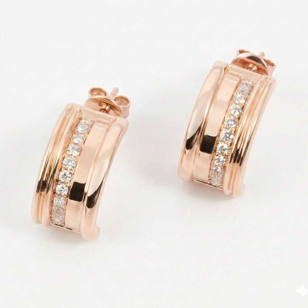 Rose gold hoop earrings with diamond accents on a light gray background