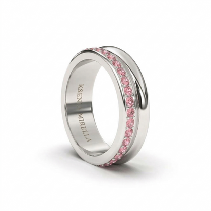 White gold pink sapphire full eternity ring wedding band on a white background 