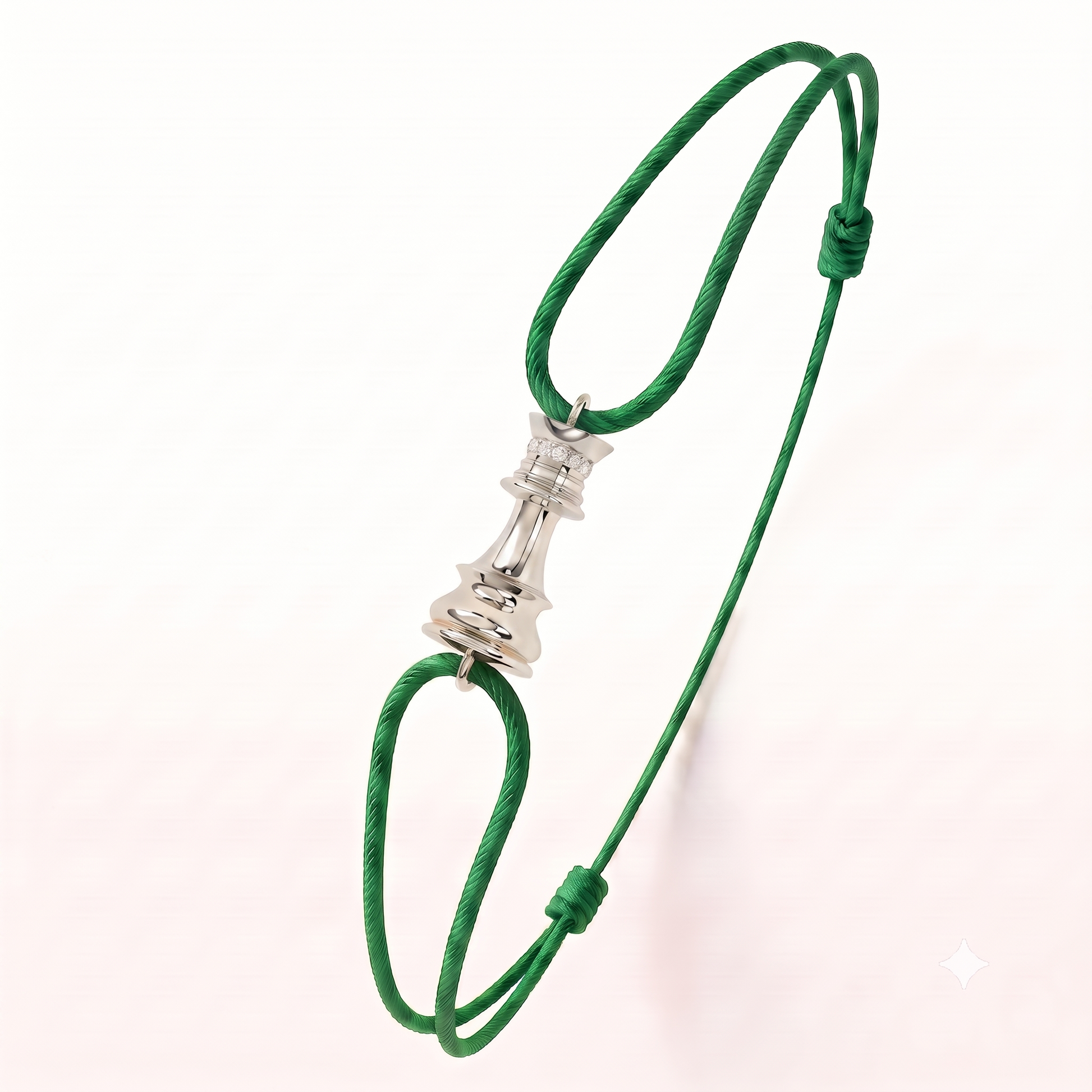 A green adjustable cord bracelet featuring a white gold diamond chess piece charm in the center, displayed on a clean white background.