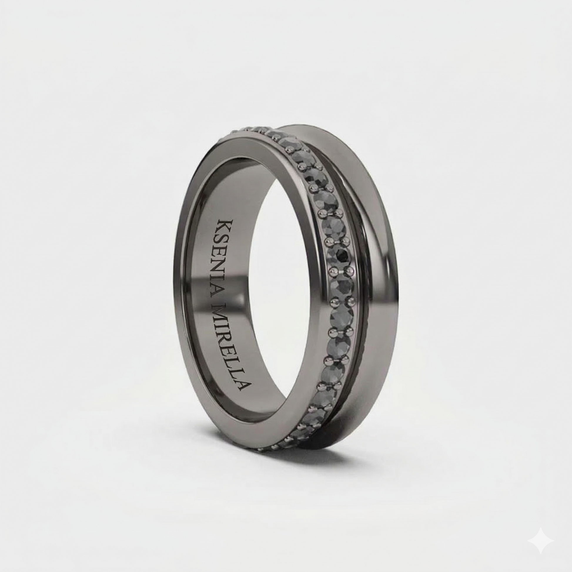 A black gold band ring with black diamonds set around its circumference.