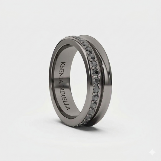 A black gold band ring with black diamonds set around its circumference.