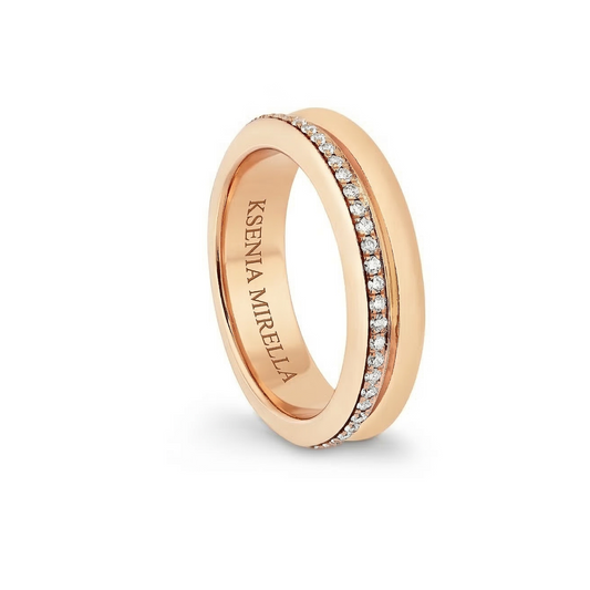 yellow gold ring with embedded diamonds on a white background
