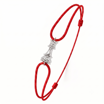A red adjustable cord bracelet featuring a polished silver-toned chess piece charm in the center, displayed on a clean white background.