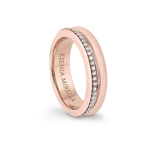 Rose gold ring with embedded diamonds on a white background