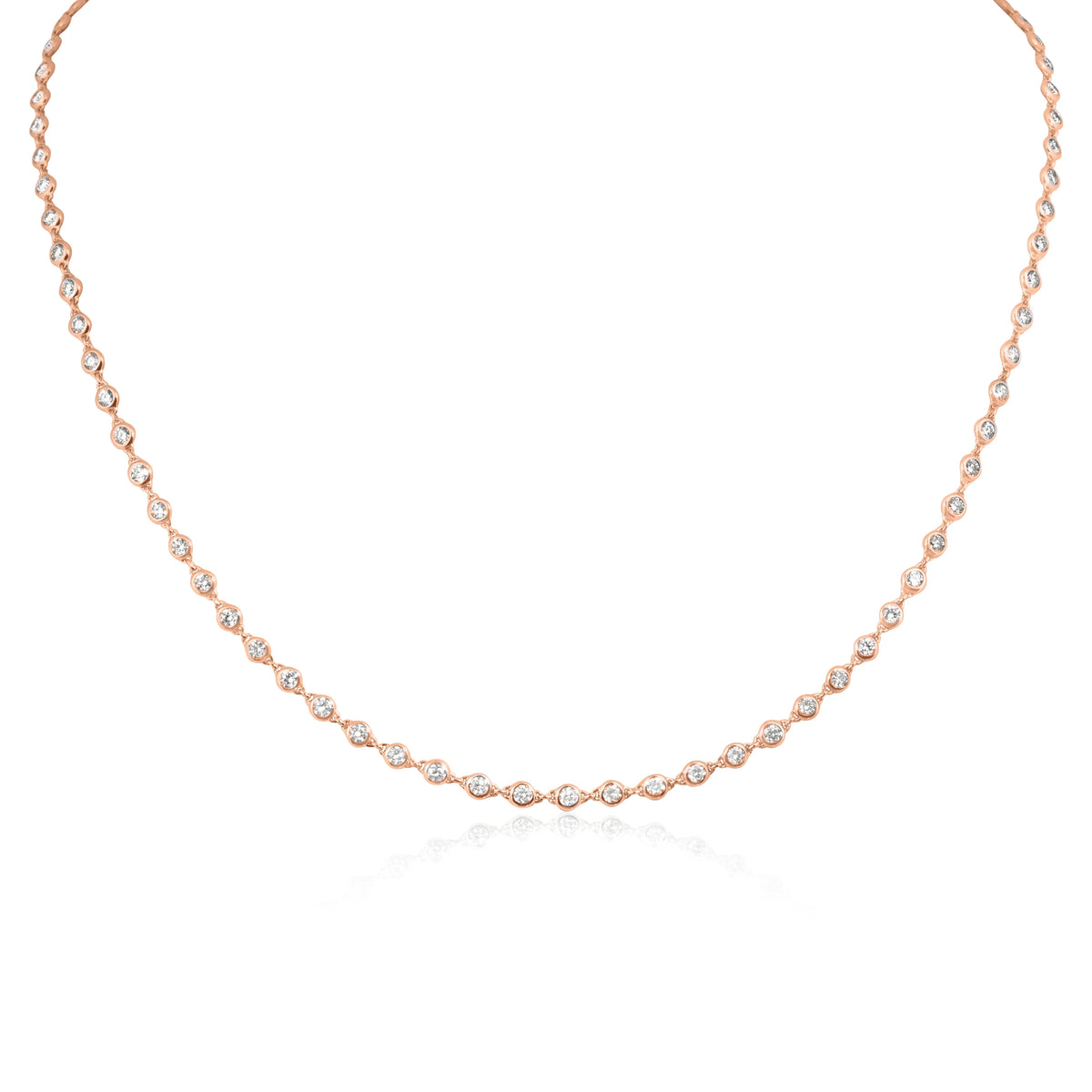 A delicate rose gold tennis necklace featuring marquise-cut clear stones set along the chain, displayed on a clean white background with a soft reflection below.