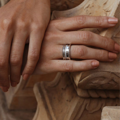 White gold diamond band ring by Ksenia Mirella Jewellery worn on hand in warm natural light