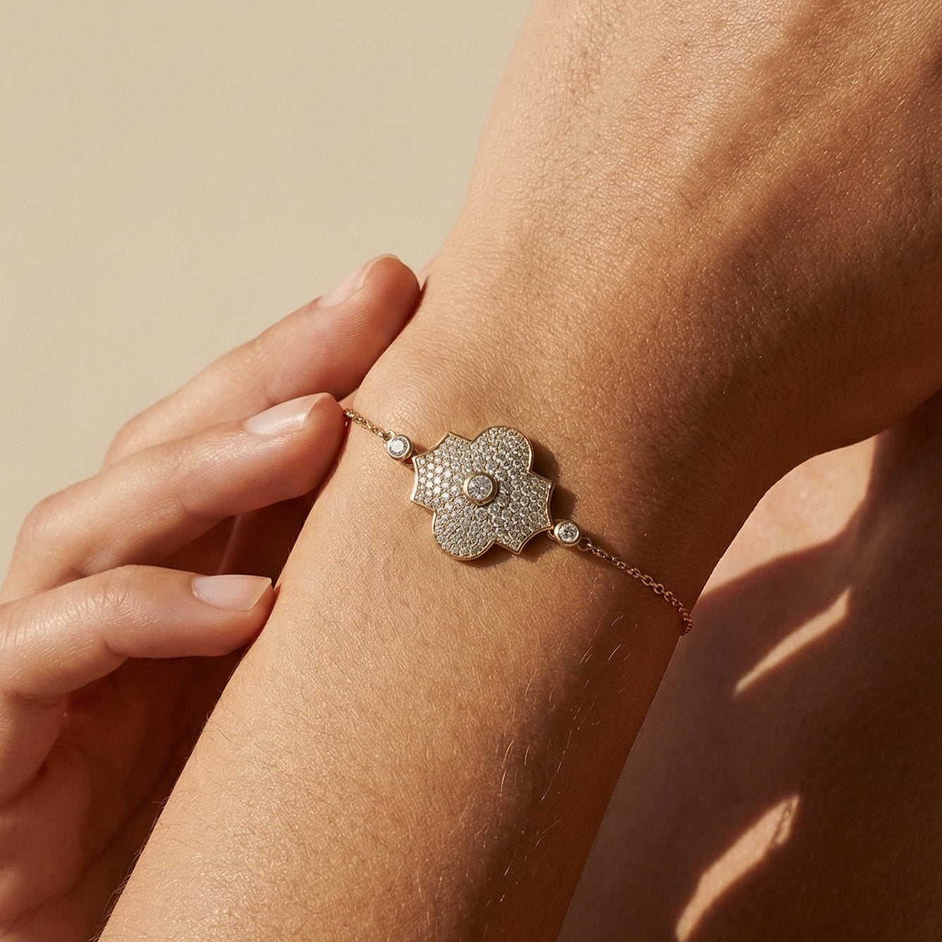 yellow gold model style bracelet worn by a model 