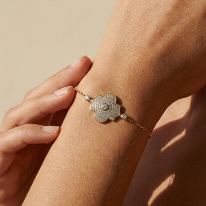 yellow gold model style bracelet worn by a model 