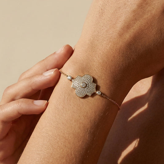 yellow gold model style bracelet worn by a model 