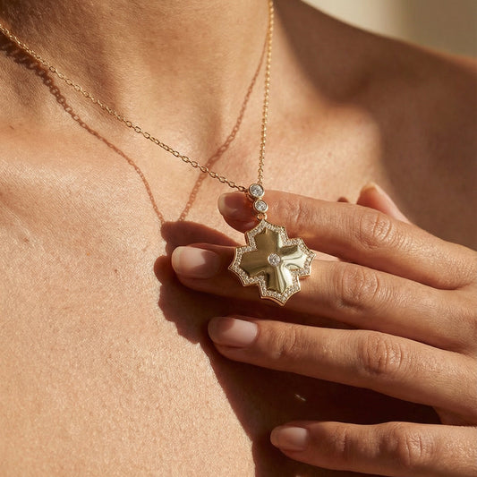 modern yellow gold white diamond statement necklace worn by a model 
