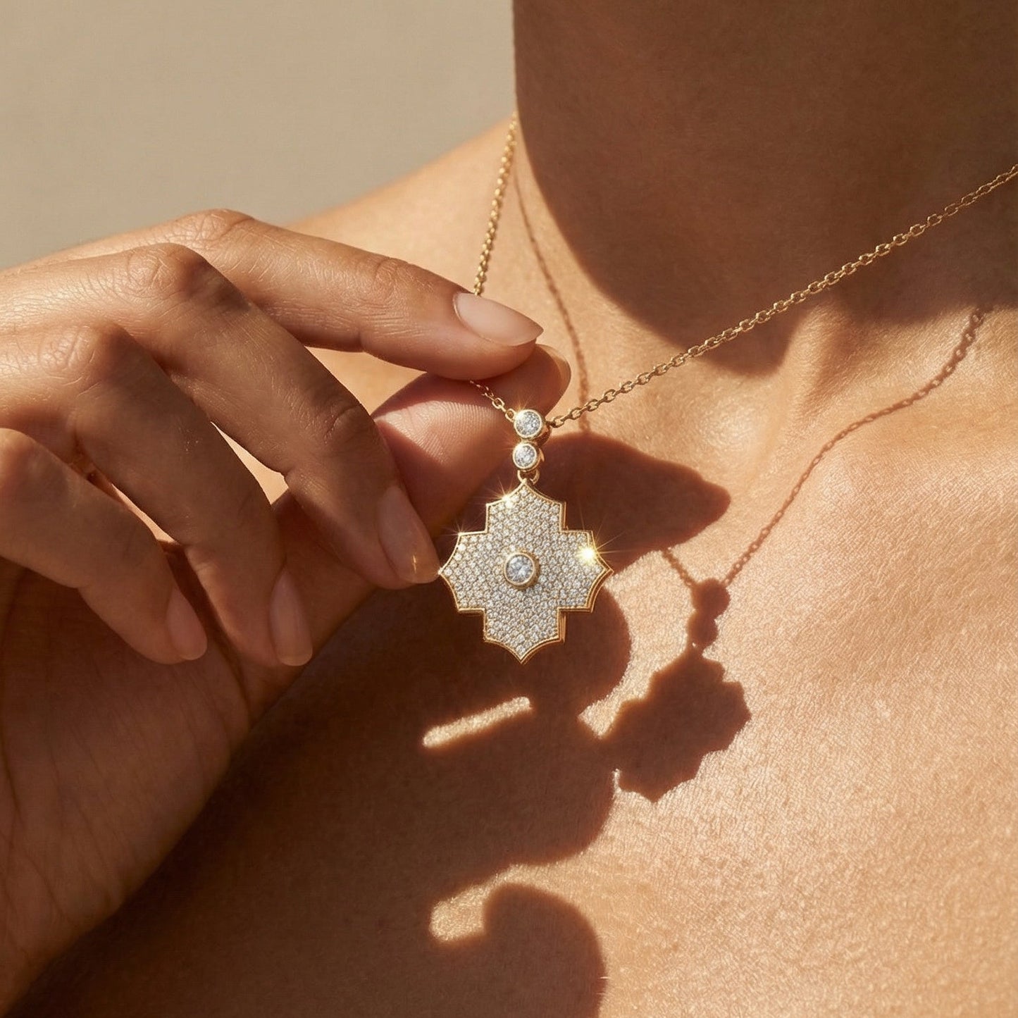 Close-up of a necklace with a pendant on a person's neck against a neutral background