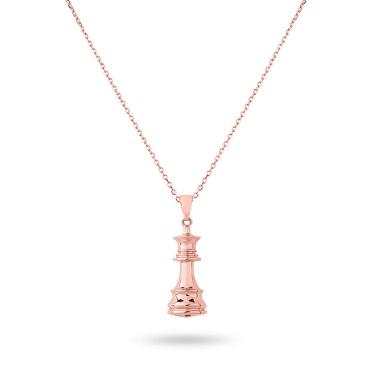 A rose gold chess necklace with a pendant featuring the queen piece on a chain.